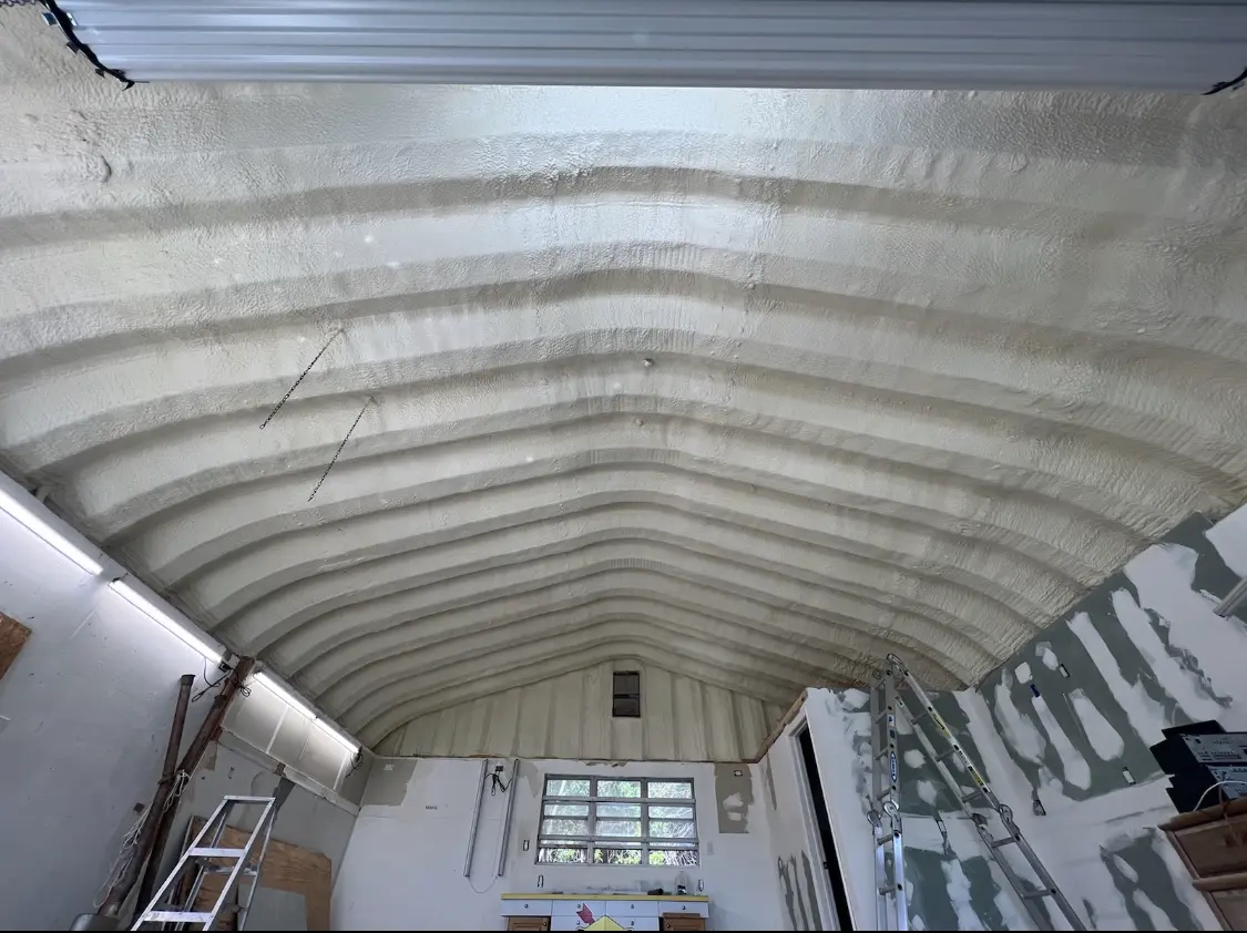Spray polyurethane foam applied to the underside of a metal roof deck in Golden